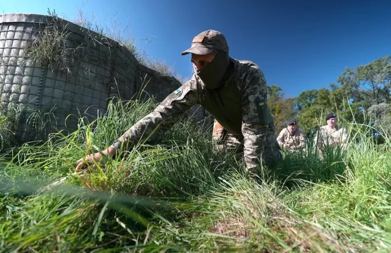 Training to clear the world’s most heavily mined country