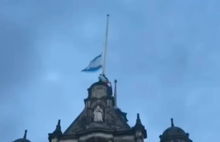 Man scales Sheffield town hall to remove Israeli flag