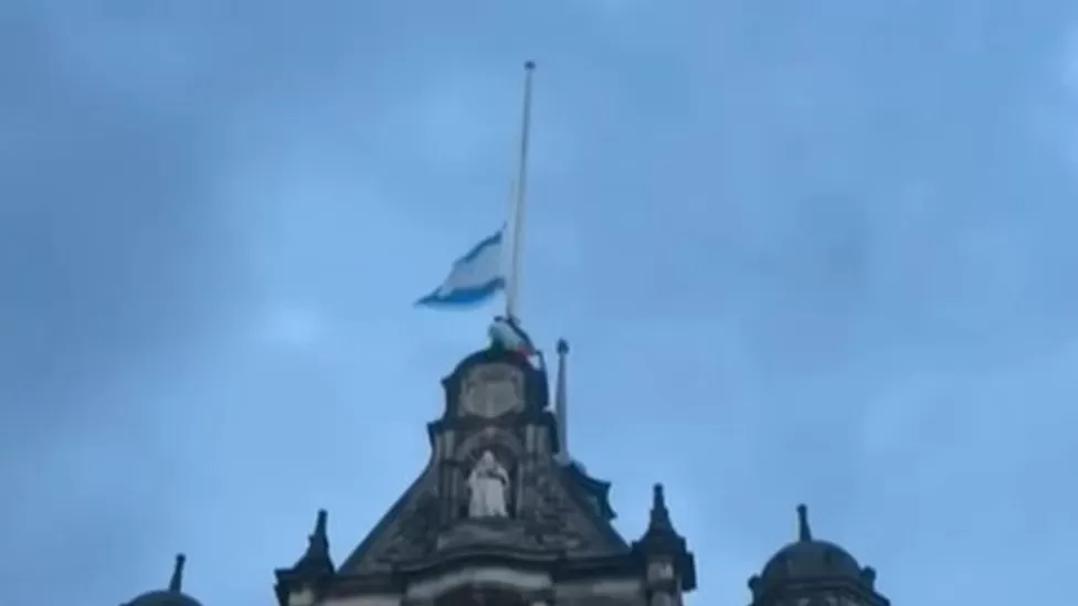 Man scales Sheffield town hall to remove Israeli flag