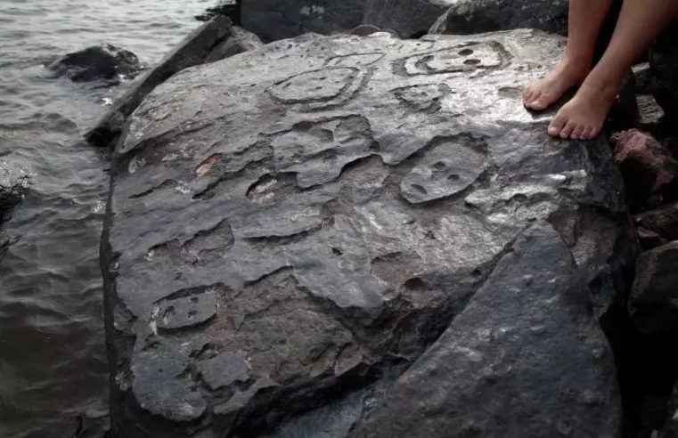 Brazil drought reveals ancient rock carvings of human faces